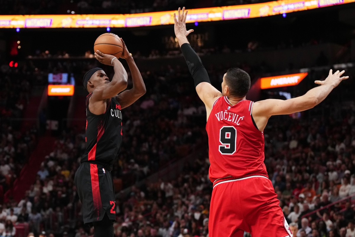 Miami Heat forward Jimmy Butler (22) shoots over Chicago Bulls center Nikola Vucevic (9) during the second half at Kaseya Center.