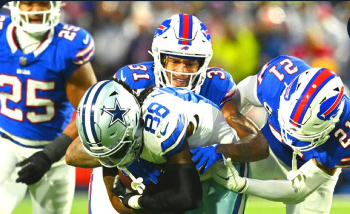 Bills defenders converge on Cowboys receiver CeeDee Lamb.