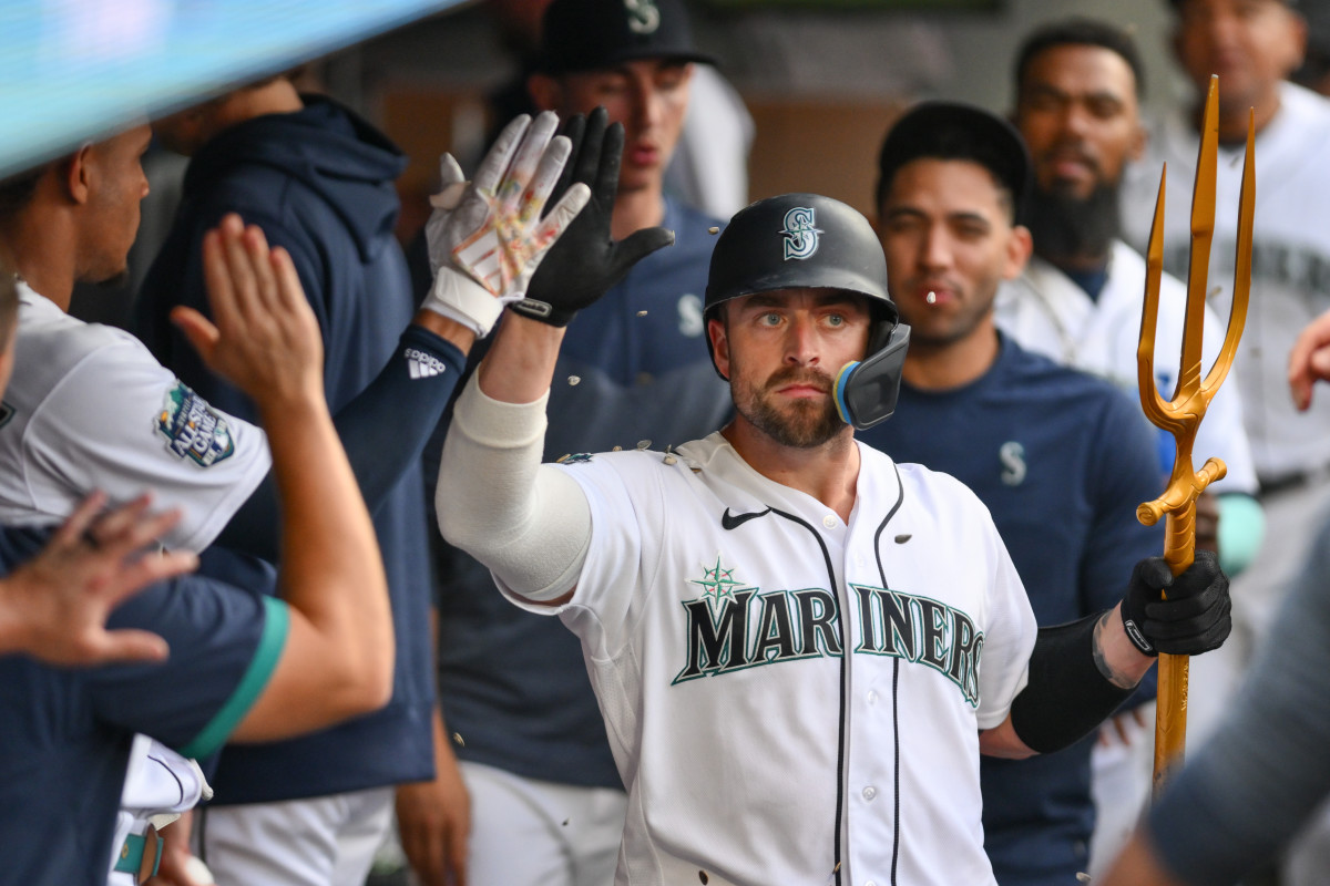 Seattle Mariners catcher Tom Murphy celebrates in the dugout after hitting a home run against the Minnesota Twins during the sixth inning at T-Mobile Park. (2023)