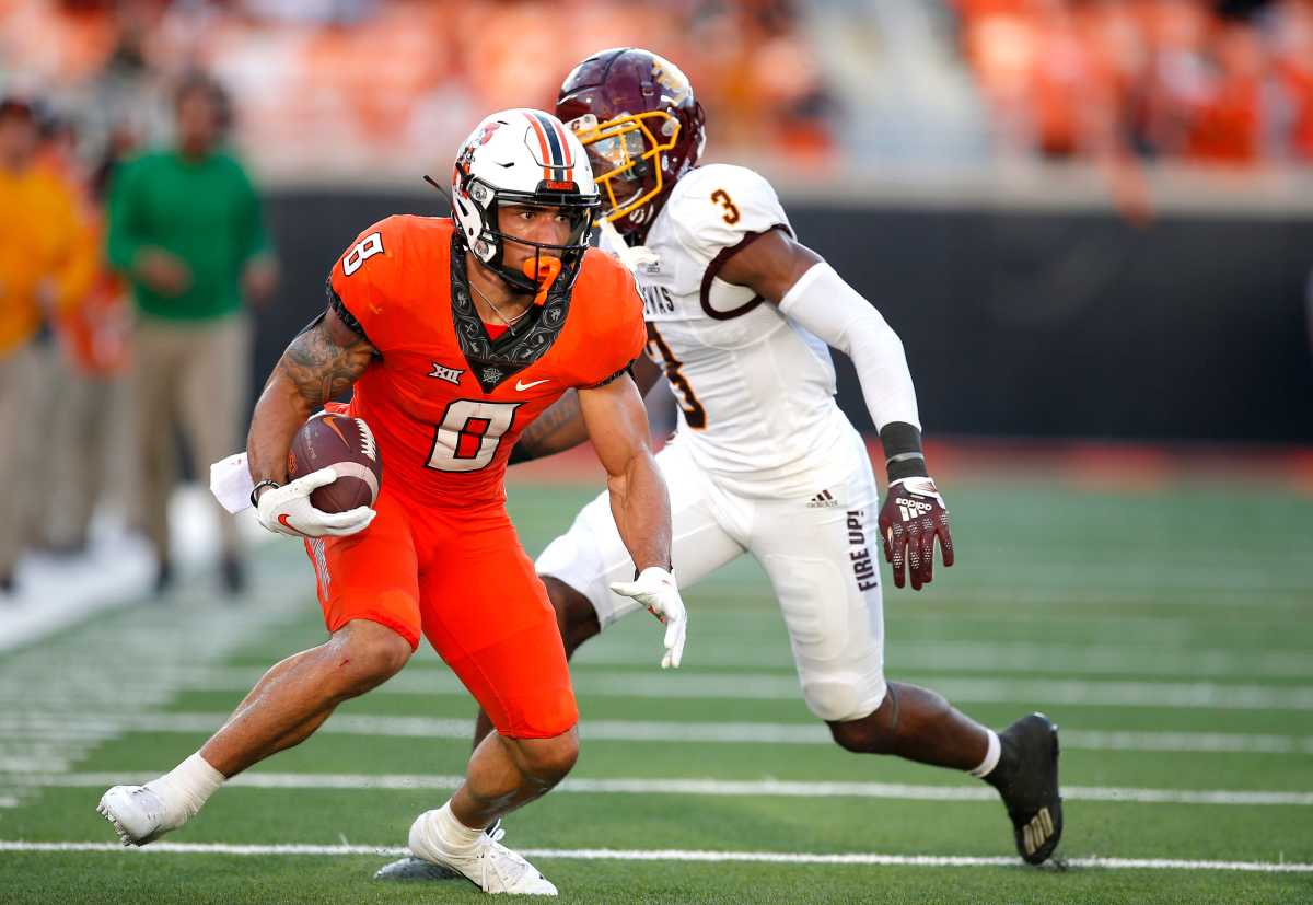 OSU's Braydon Johnson (8) catches a pass as Central Michigan's Trey Jones (3)  defend in the first quarter.