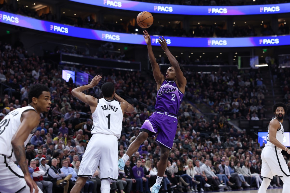 Utah Jazz guard Collin Sexton (2) shoots the ball over Brooklyn Nets forward Mikal Bridges (1)