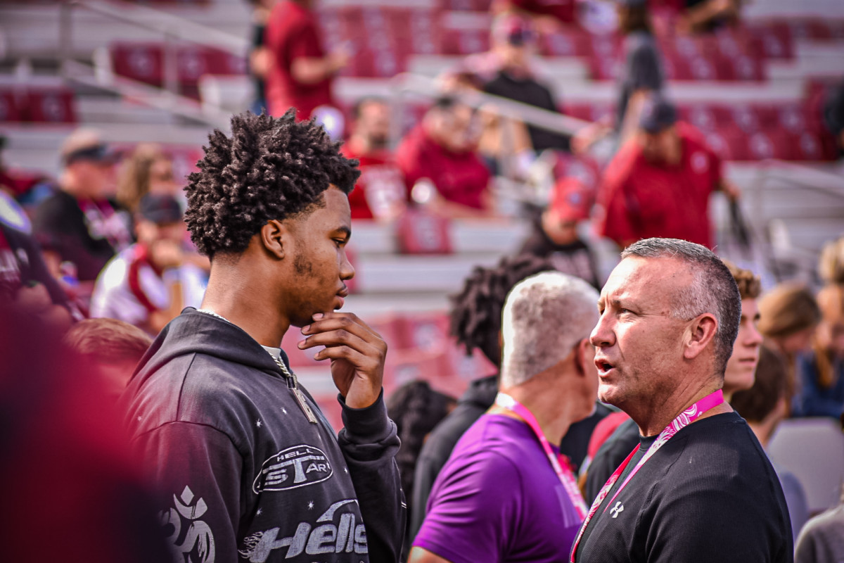 Dylan Stewart talking to someone on the sidelines during Carolina's pregame warmups (14th Oct., 2023)