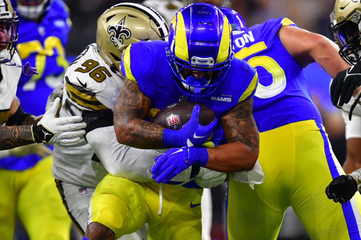 Dec 21, 2023; Inglewood, California, USA; Los Angeles Rams running back Kyren Williams (23) runs the ball against New Orleans Saints defensive end Carl Granderson (96) during the first half at SoFi Stadium.