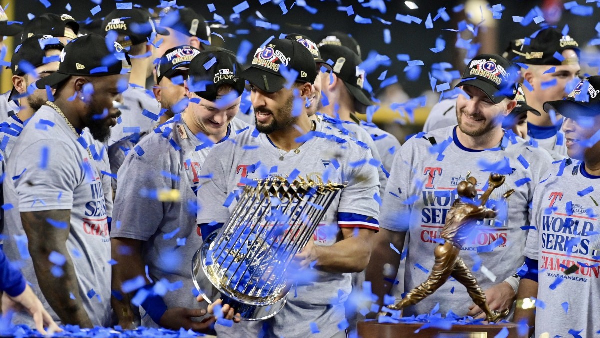 Marcus Semien celebrates the Rangers' World Series title.