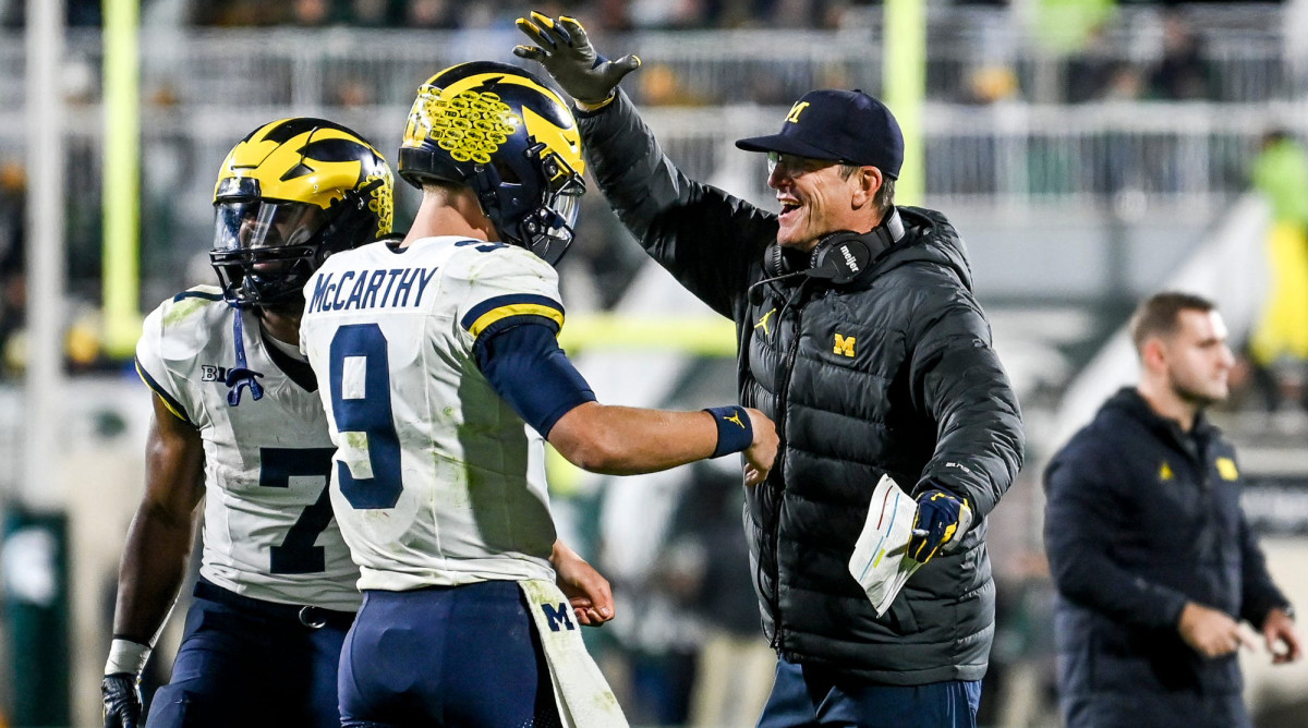 Jim Harbaugh celebrating with J.J. McCarthy