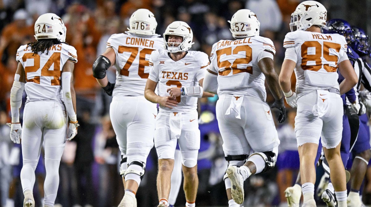 Quinn Ewers celebrates with Texas.