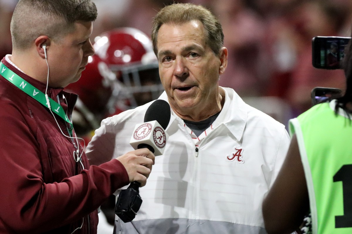 Alabama Crimson Tide head coach Nick Saban talks with a reporter at halftime of the SEC championship game against Georgia.