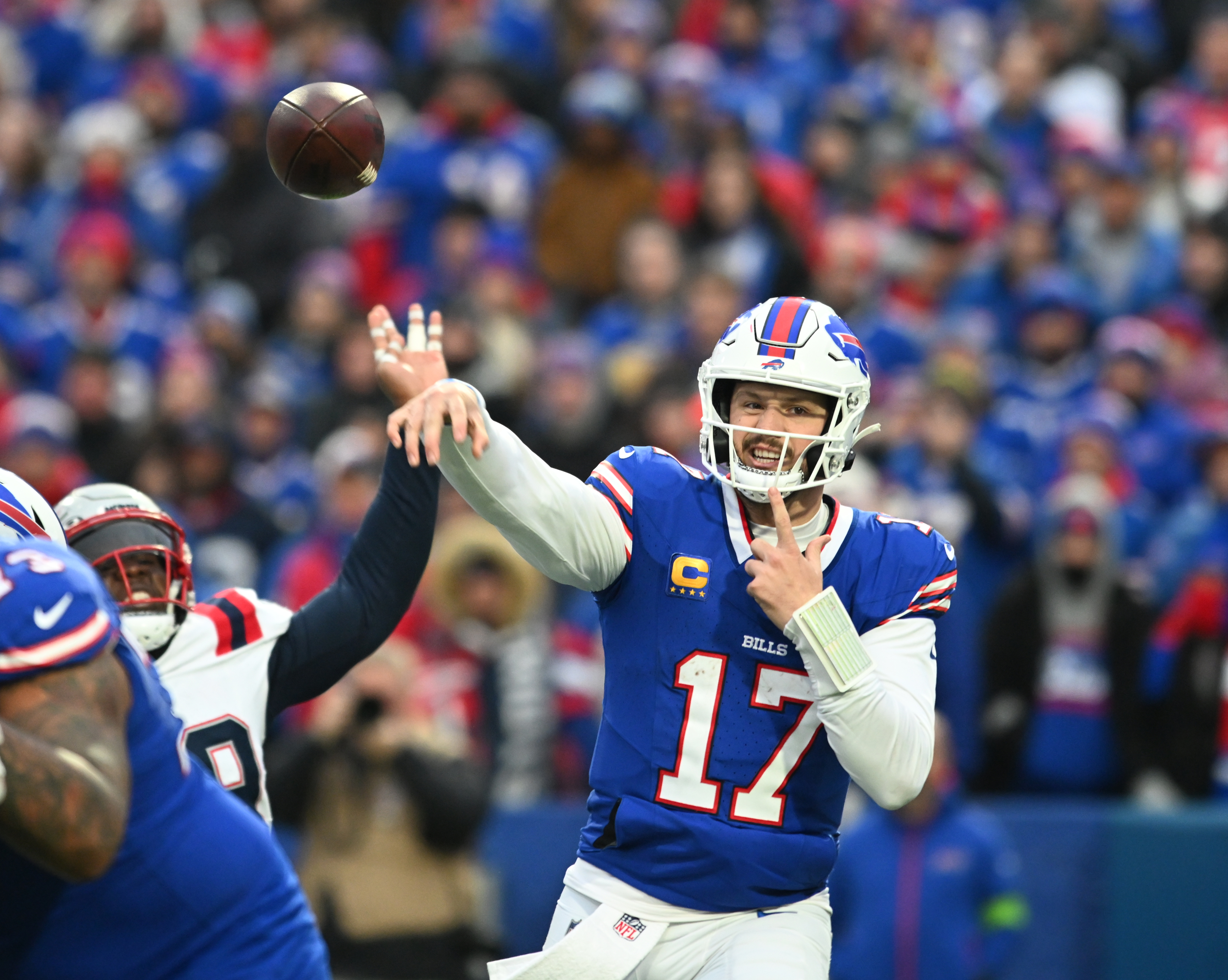 Josh Allen throwing a pass vs. the New England Patriots.