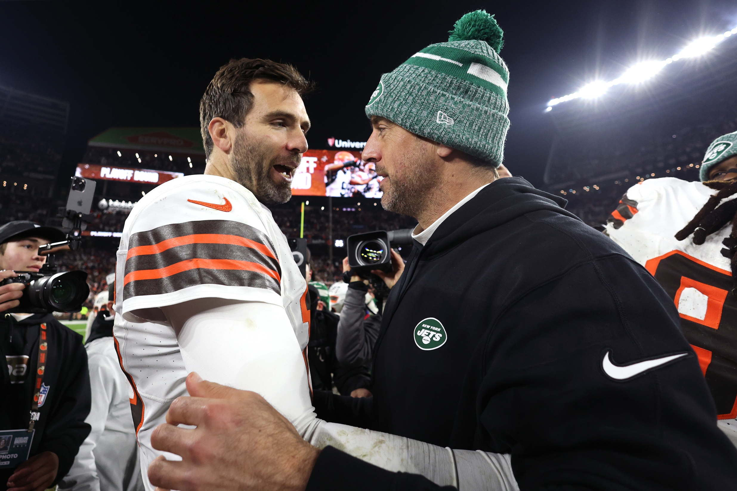 Dec 28, 2023; Cleveland, Ohio, USA; Cleveland Browns quarterback Joe Flacco (left) and New York Jets quarterback Aaron Rodgers (right) meet after the game at Cleveland Browns Stadium. Mandatory Credit: Scott Galvin-USA TODAY Sports