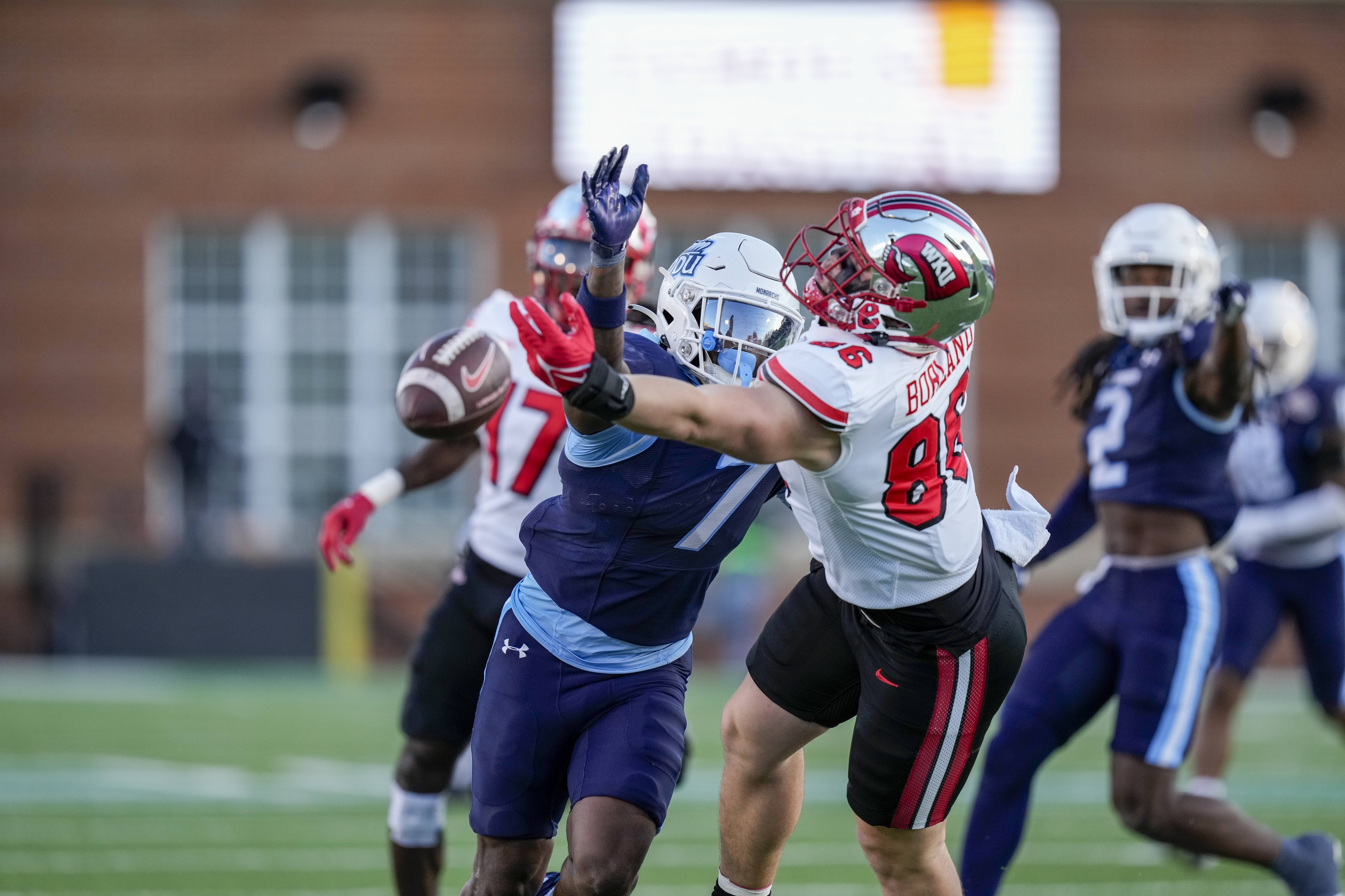 Western Kentucky Hilltoppers tight end Trevor Borland (86) just misses the throw defended by Old Dominion Monarchs safety Shawn Asbury II (7) during the second half at Charlotte 49ers' Jerry Richardson Stadium.