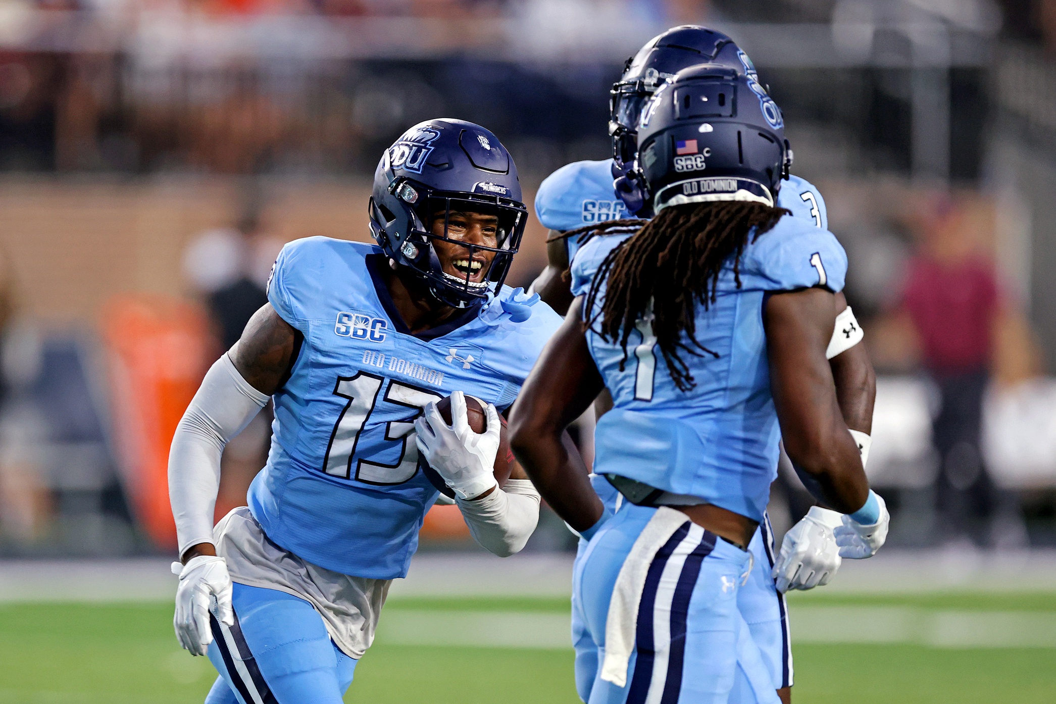 Old Dominion Monarchs safety Terry Jones (13) celebrates after an interception during the first quarter against the Virginia Tech Hokies at Kornblau Field at S.B. Ballard Stadium.