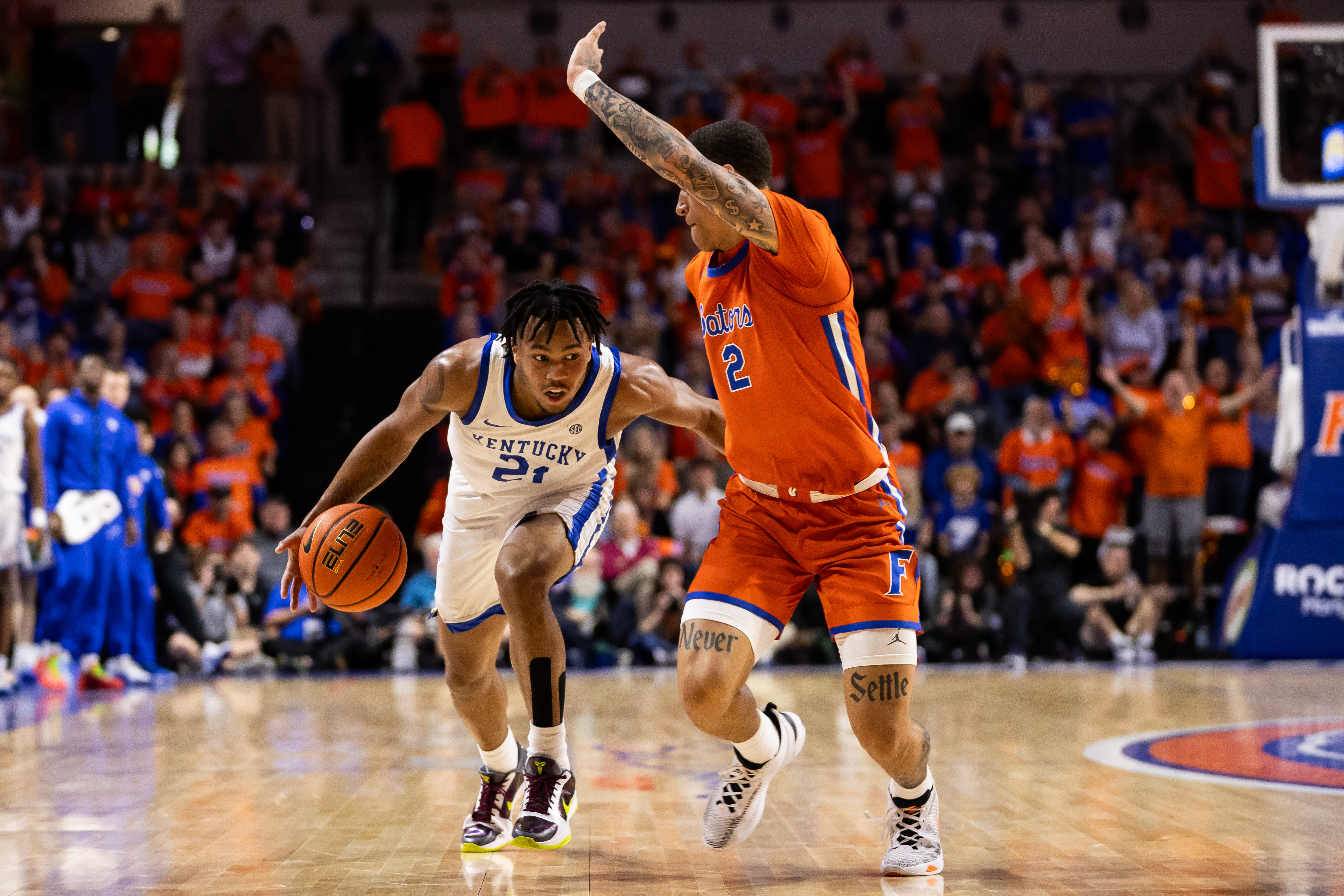 Jan 6, 2024; Gainesville, Florida, USA; Kentucky Wildcats guard D.J. Wagner (21) dribbles the ball at Florida Gators guard Riley Kugel (2) during the first half at Exactech Arena at the Stephen C. O'Connell Center. Mandatory Credit: Matt Pendleton-USA TODAY Sports