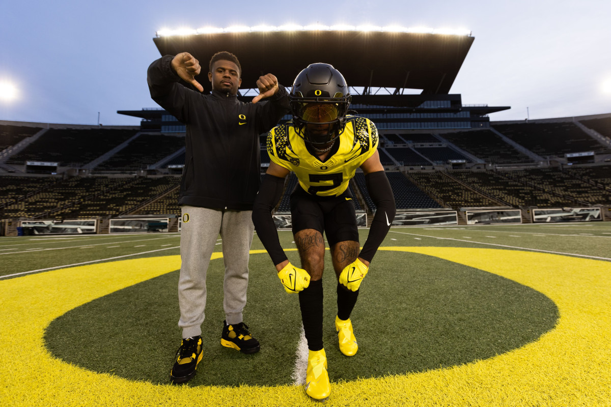 Kam Alexander with Oregon Assistant wide receivers coach Antonio Parks during his official visit.