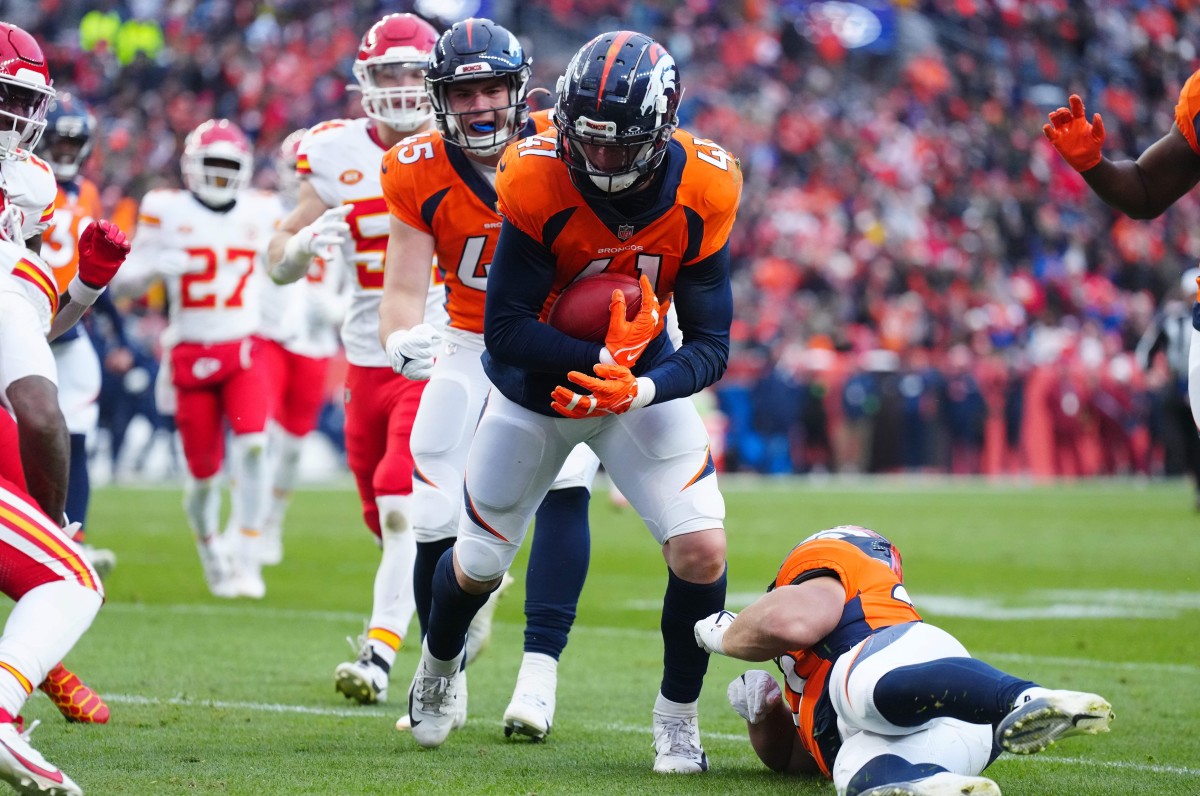 Oct 29, 2023; Denver, Colorado, USA; Denver Broncos linebacker Drew Sanders (41) advances a fumble recovery in the fourth quarter against the Kansas City Chiefs at Empower Field at Mile High. Mandatory Credit: Ron Chenoy-USA TODAY Sports  