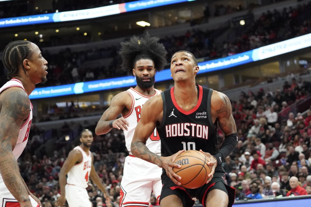 Chicago Bulls guard Coby White (0) defends Houston Rockets forward Jabari Smith Jr. (10) during the first quarter at United Center.