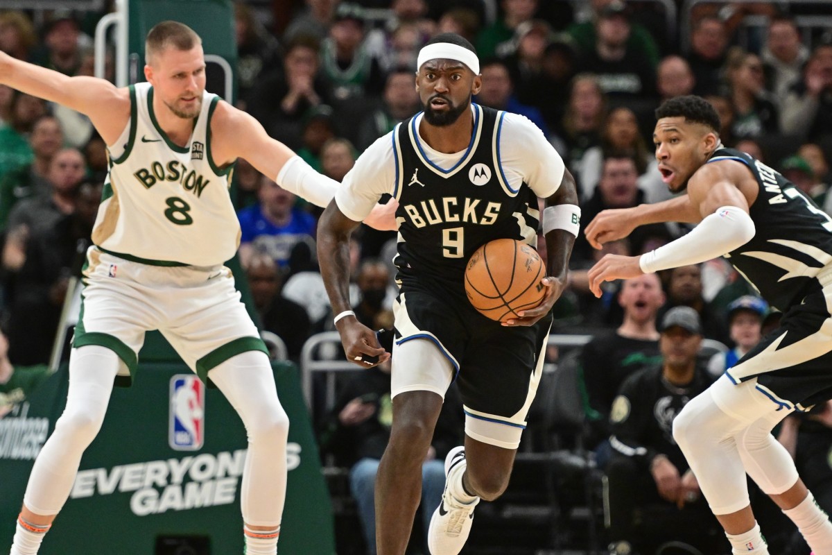  Milwaukee Bucks forward Bobby Portis (9) brings the ball down court against Boston Celtics center Kristaps Porzingis (8)