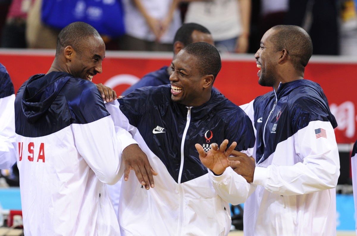 United States guards Kobe Bryant (10) and Dwyane Wade (9) and Michael Redd (8) react 