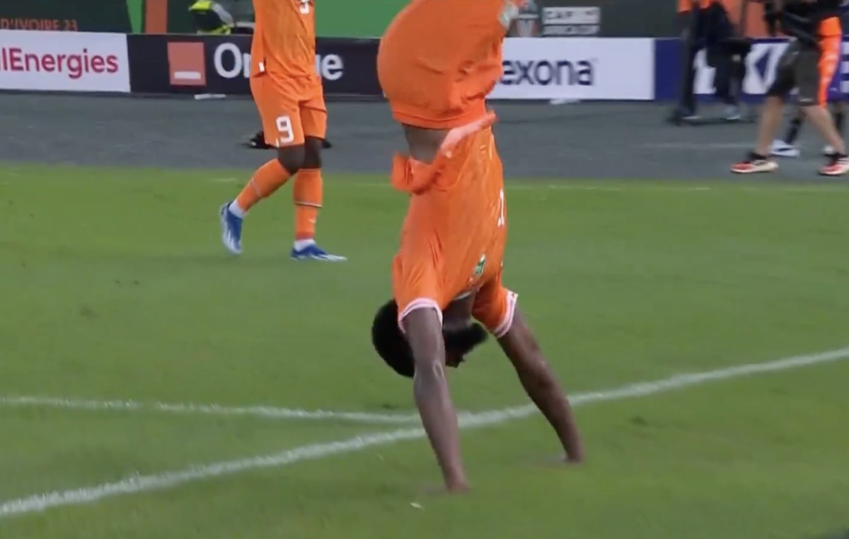 Jean-Philippe Krasso pictured performing a somersault after scoring a goal for the Ivory Coast in a 2-0 win over Guinea-Bissau in the Africa Cup of Nations in January 2024