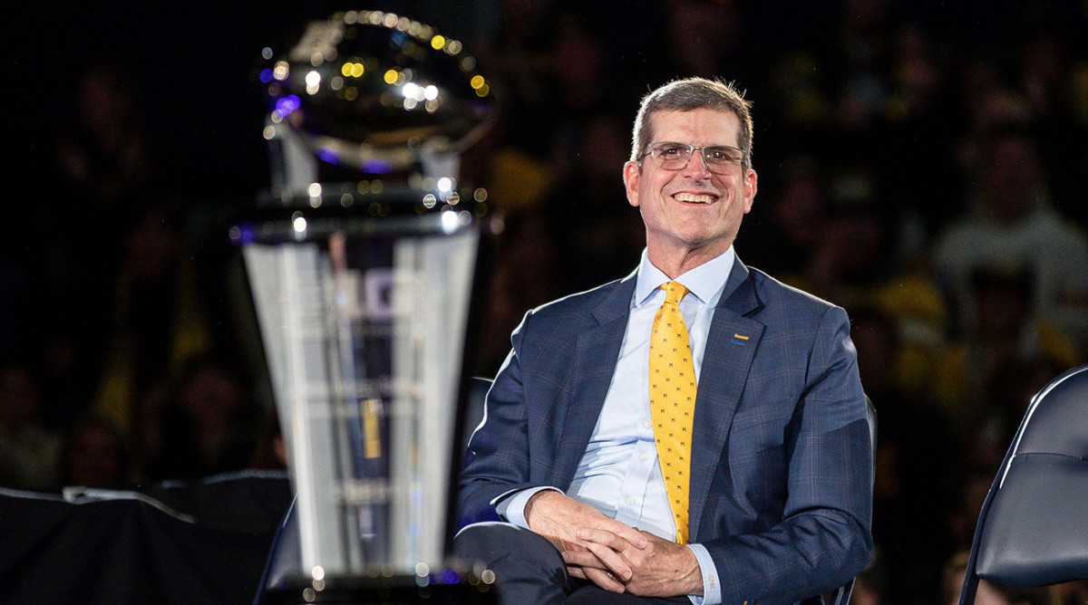 Michigan coach Jim Harbaugh looks on during the national championship celebration at Crisler Center in Ann Arbor on Saturday.