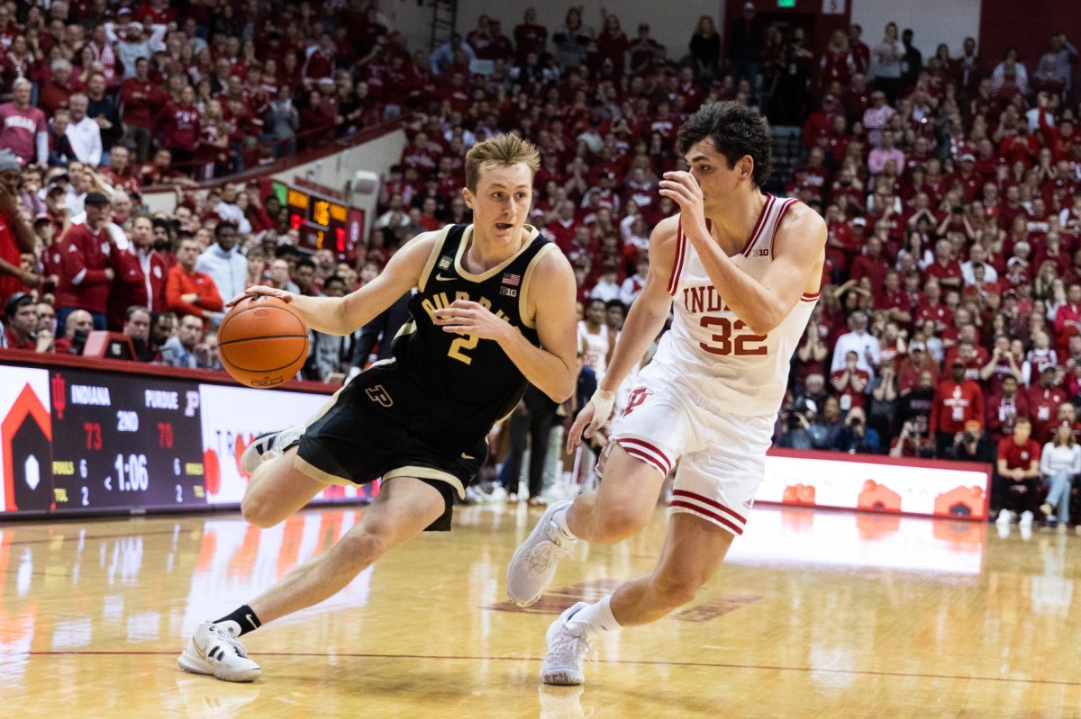 Purdue Boilermakers guard Fletcher Loyer (2) dribbles the ball while Indiana Hoosiers guard Trey Galloway (32) defends in the second half at Simon Skjodt Assembly Hall.