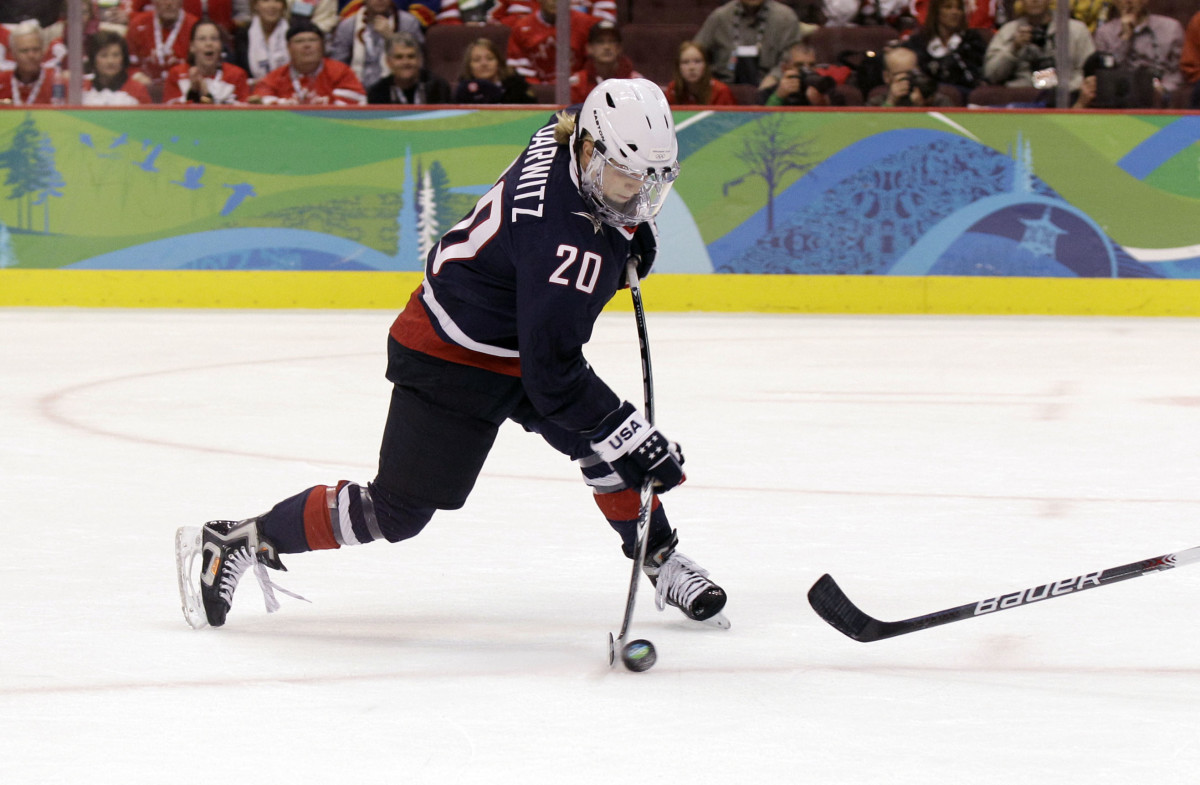 Natalie Darwitz fires a shot during the 2010 Olympics