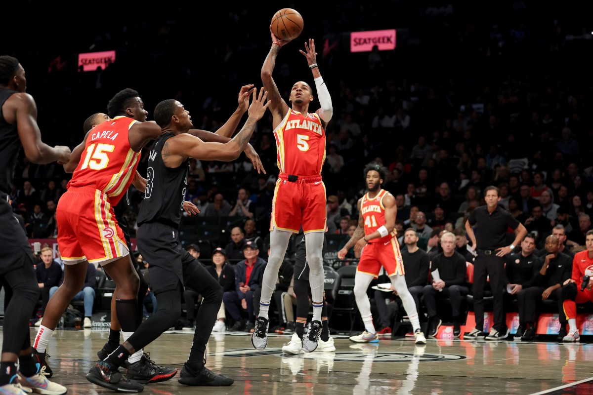 Atlanta Hawks guard Dejounte Murray (5) shoots against Brooklyn Nets center Nic Claxton (33)