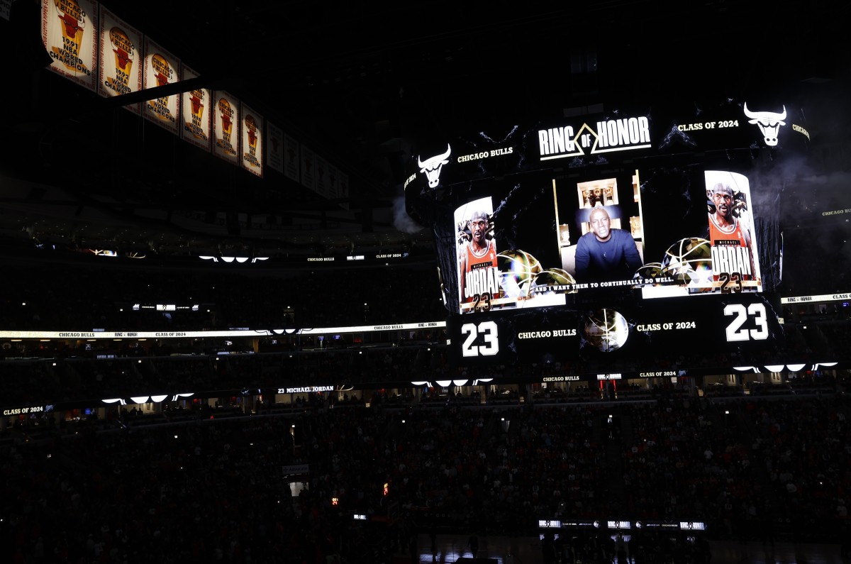 Chicago Bulls class of 2024 Ring of Honor inductee and former player Michael Jordan gives thanks via a video message for being honored during the inaugural ceremony at halftime of a game between the Bulls and Golden State Warriors at United Center.