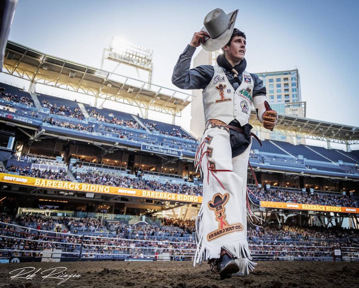 Professional Bareback Rider Jayco Roper, Oktaha, OK captured tipping his hat to the crowd at Petco Park in San Diego, CA.