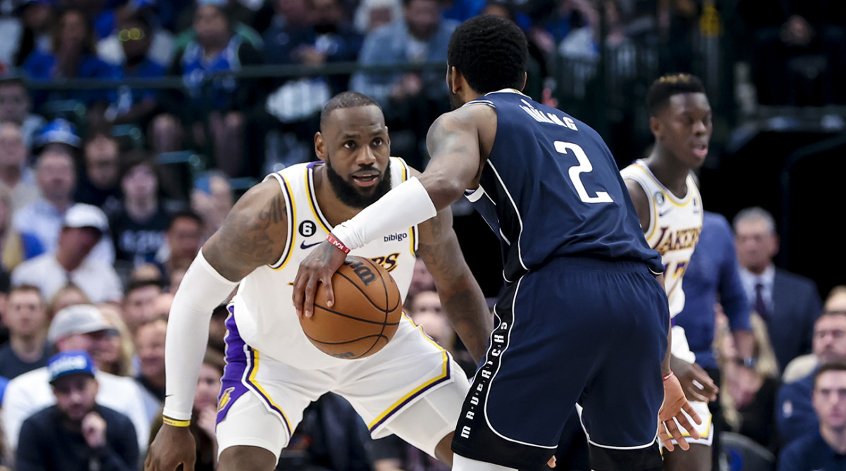 Los Angeles Lakers forward LeBron James (6) guards Dallas Mavericks guard Kyrie Irving (2) during the fourth quarter at American Airlines Center.