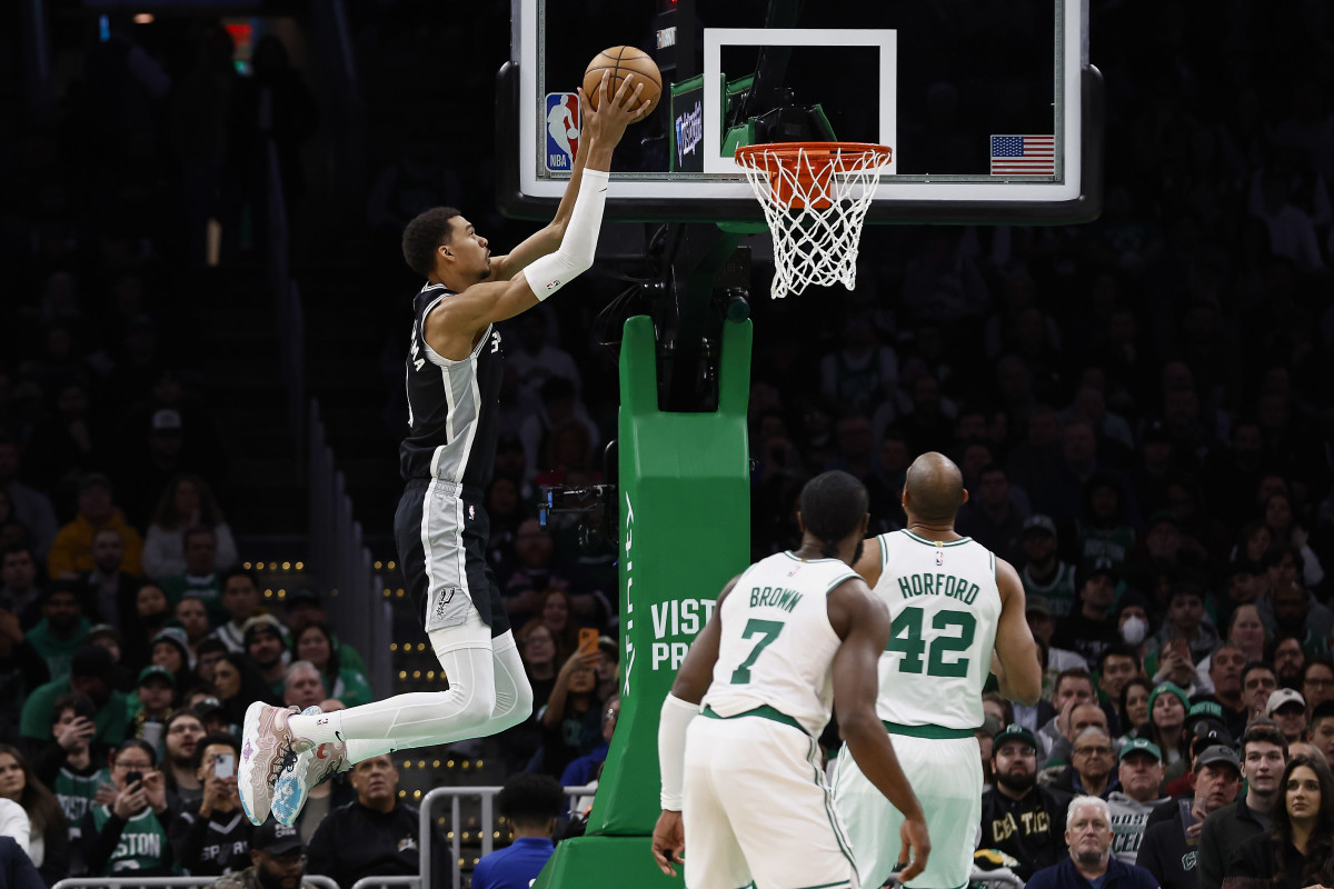 Boston, MA: San Antonio Spurs center Victor Wembanyama (1) dunks while Jaylen Brown (7) and Al Horford (42) of the Boston Celtics look on. Jan. 17, 2024.