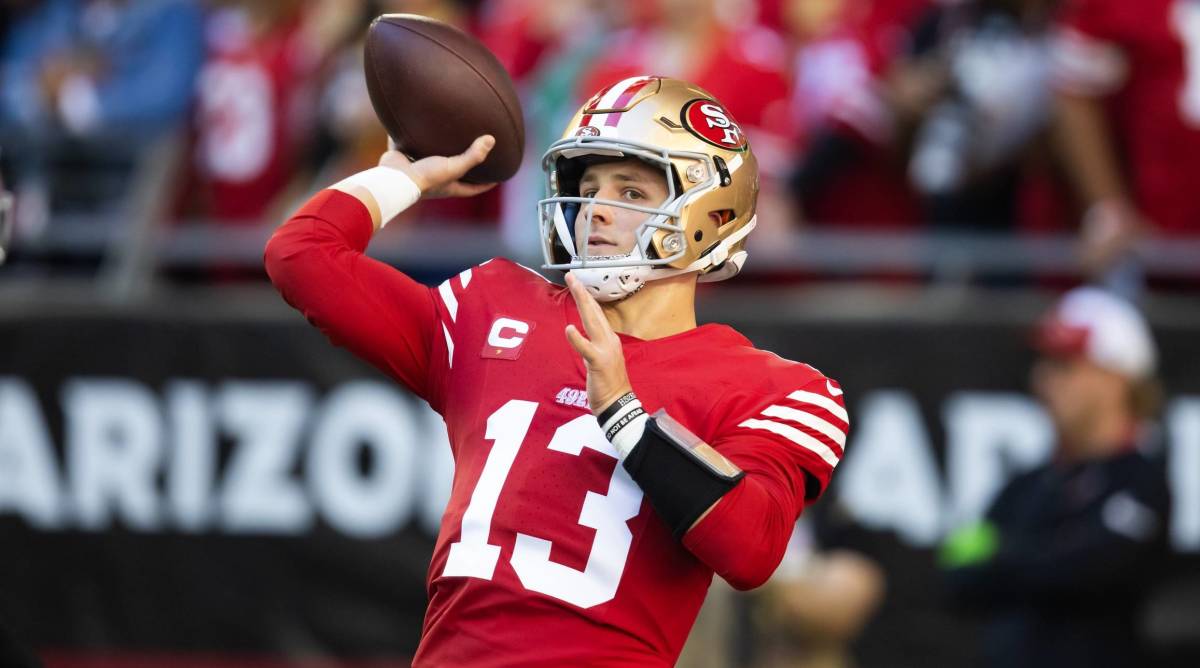 San Francisco 49ers quarterback Brock Purdy throws a ball in warmups before a game.