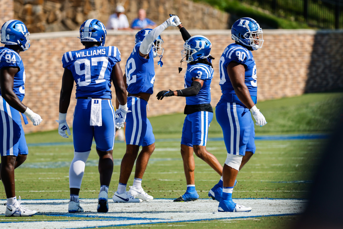 Duke Blue Devils defensive back Brandon Johnson (3) and running back Grissim Anderson (41) during the first half against Northwestern Wildcats.