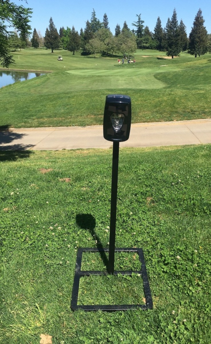 At WildHawk Golf Club in Sacramento, Calif., hand-sanitizing stations built by the maintenance crew stand as prominent reminders for golfers to observe coronavirus protocols. 