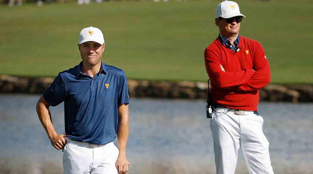 Justin Thomas of the United States Team waits alongside Assistant Captain Zach Johnson of the United States Team on the 14th green during Saturday morning foursomes on day three of the 2022 Presidents Cup at Quail Hollow Country Club.