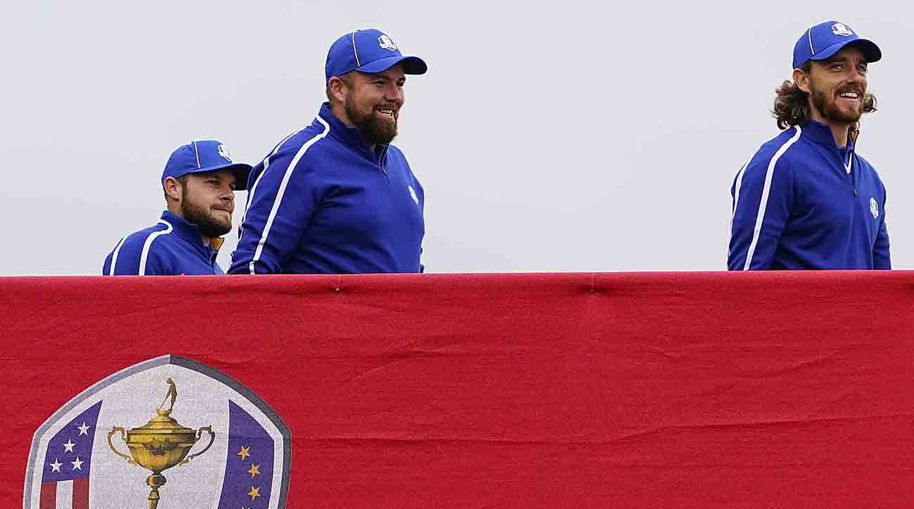 Team Europe players Tyrrell Hatton (left), Shane Lowry (center) and Tommy Fleetwood cross the bridge to the 10th tee during practice rounds for the 2021 Ryder Cup at Whistling Straits.