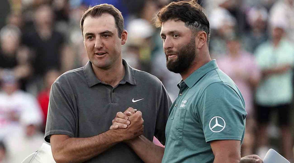 Scottie Scheffler and Jon Rahm shake after the third round at the WM Phoenix Open.