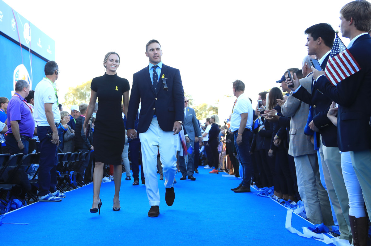 Brooks Koepka of the United States and girlfriend Jena Sims depart the opening ceremony for the 2018 Ryder Cup at Le Golf National on September 27, 2018 in Paris, France.