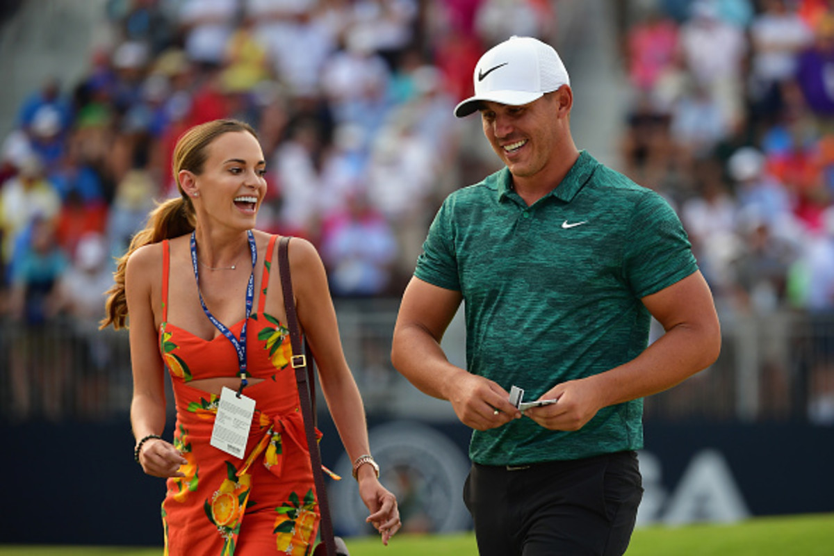 Brooks Koepka of the United States celebrates with his girlfriend, Jena Sims, after winning the 2018 PGA Championship with a score of -16 at Bellerive Country Club on August 12, 2018 in St Louis, Missouri