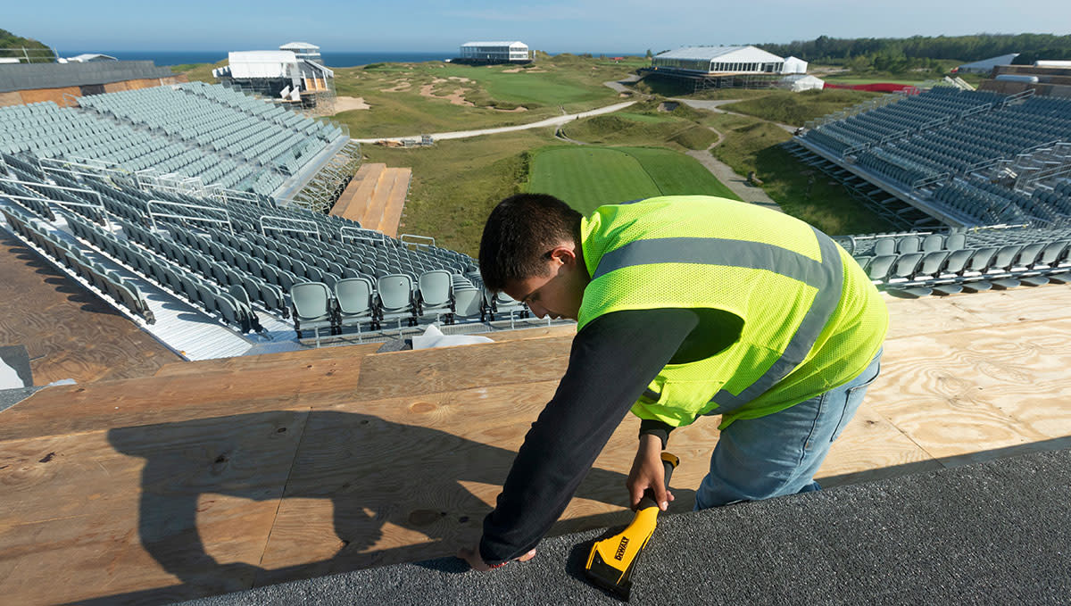 Juan Barrera builds the grandstands around the first tee at Whistling Straits.