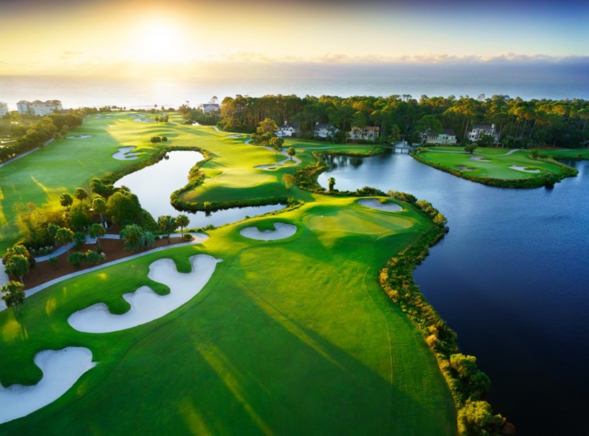 Sunrise begins to shine down on the 10th and 11th holes at Sea Pines Resort's Atlantic Dunes.