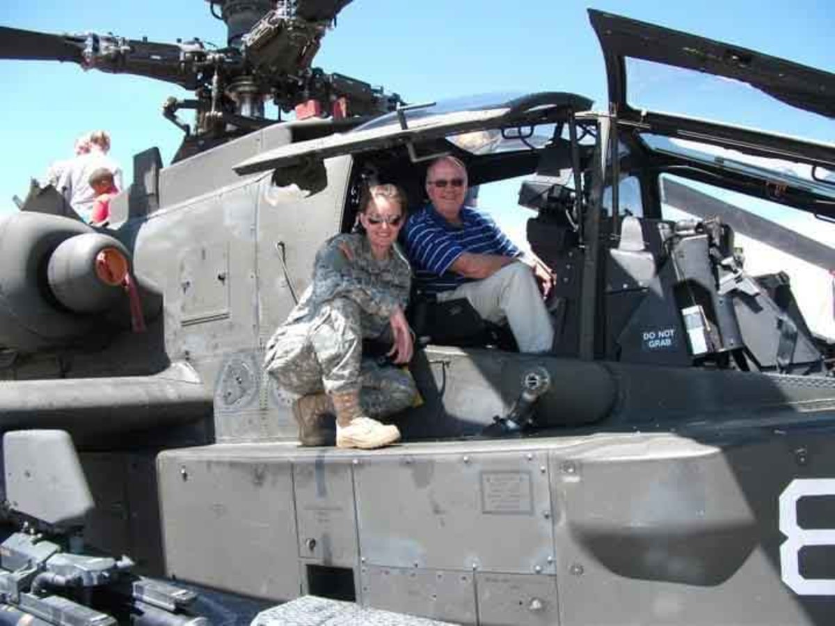 Apache helicopter pilot Capt. Kate Melcher with her dad, Joe.