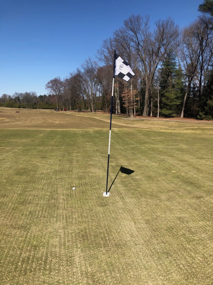 A raised cup, such as the one used here at Longmeadow (Mass.) Country Club, reduces the need for golfers to put their hands on a piece of equipment that could be a transmission hot spot for coronavirus. The club also has eliminated rakes and carts. 