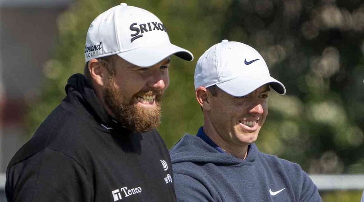 Shane Lowry (left) and Rory McIlroy smile on the fourth hole during a practice round of the 2023 British Open.