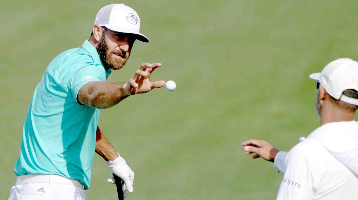 Dustin Johnson warms up at Augusta National for the 2022 Masters.