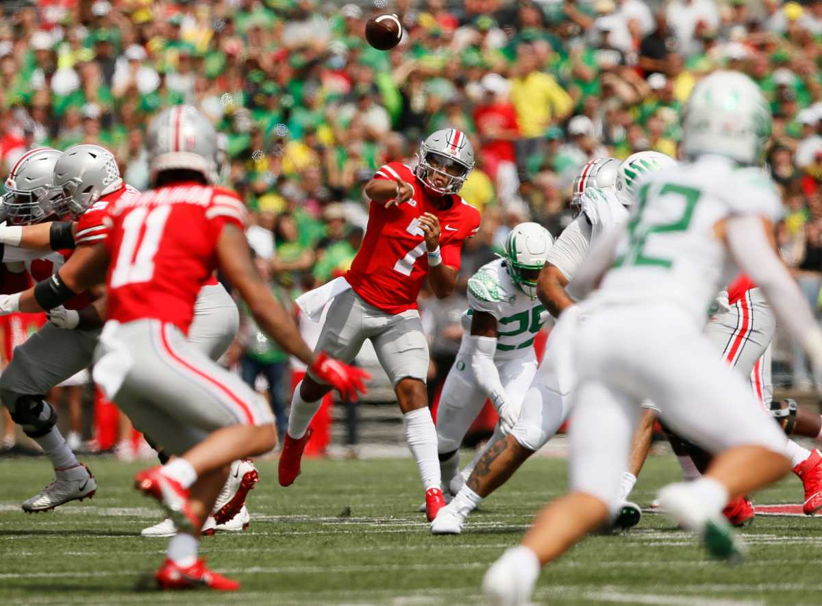 Ohio State Buckeyes quarterback C.J. Stroud (7) thorws to wide receiver Jaxon Smith-Njigba (11).