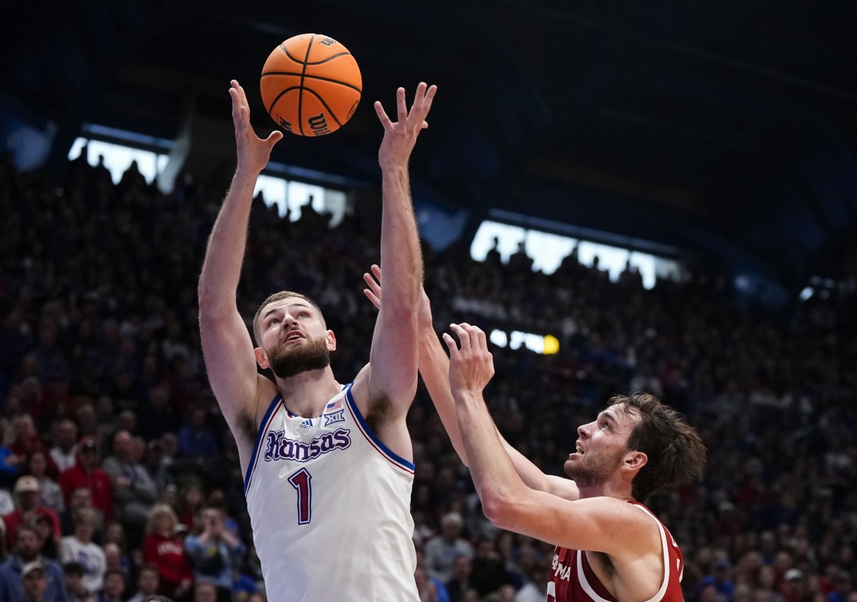 Kansas Jayhawks center Hunter Dickinson (1) rebounds against Oklahoma Sooners forward Sam Godwin (10) during the first half at Allen Fieldhouse.