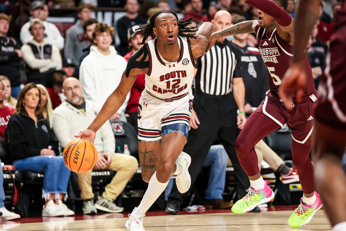 Zachary Davis drives around Mississippi State Bulldogs guard Shawn Jones Jr.