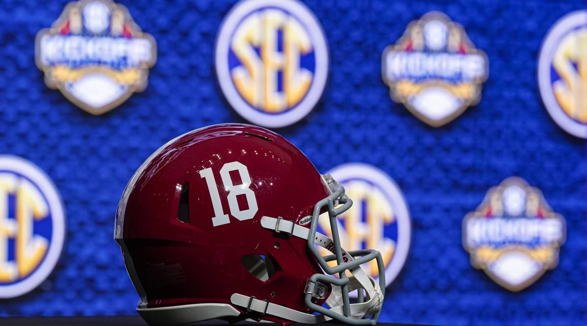 A No. 18 Alabama helmet sits on a table during SEC media day.