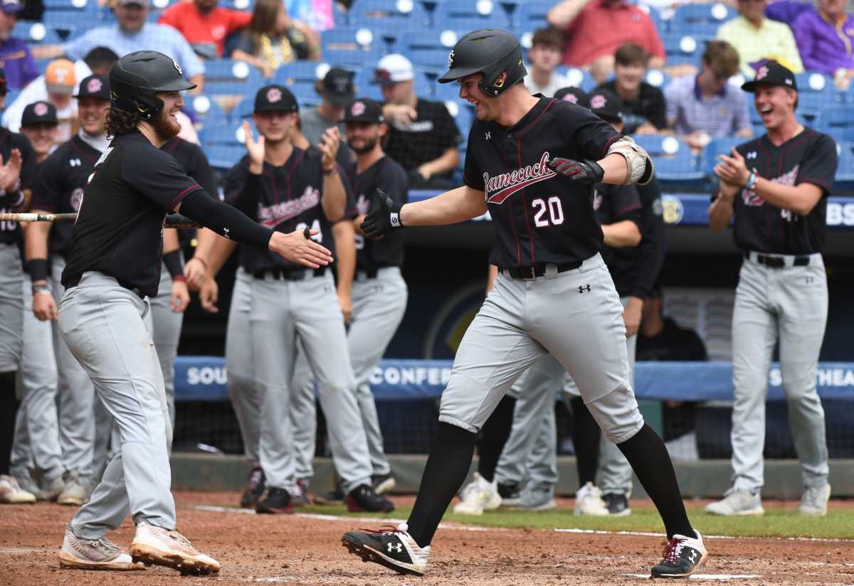 Ethan Petry high fives teammate Talmadge LeCroy after hitting a homerun in the SEC Baseball Tournament (24th May, 2023)