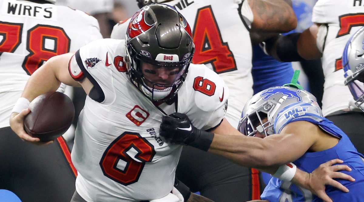 Tampa Bay Buccaneers quarterback Baker Mayfield (left) is sacked by Detroit Lions safety Brian Branch.